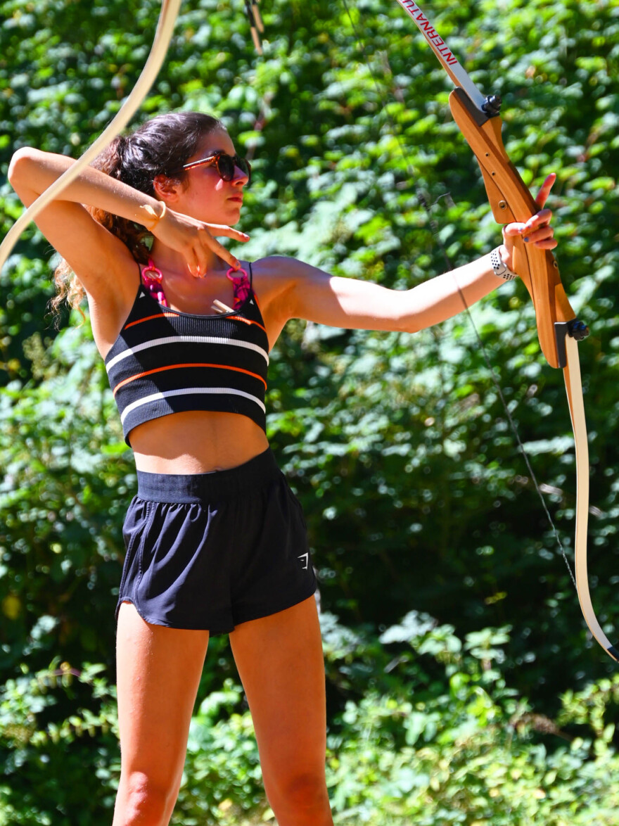 girl practicing archery.