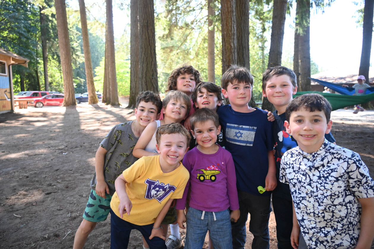 group of young boys in the woods.