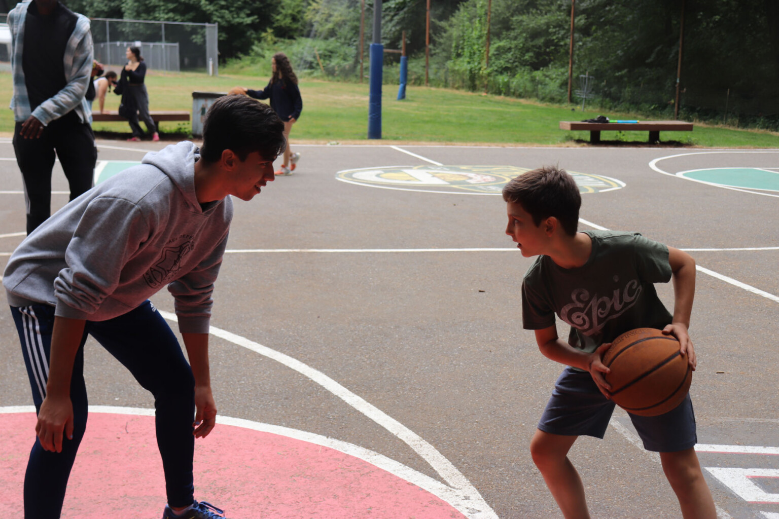 two kids playing basketball.