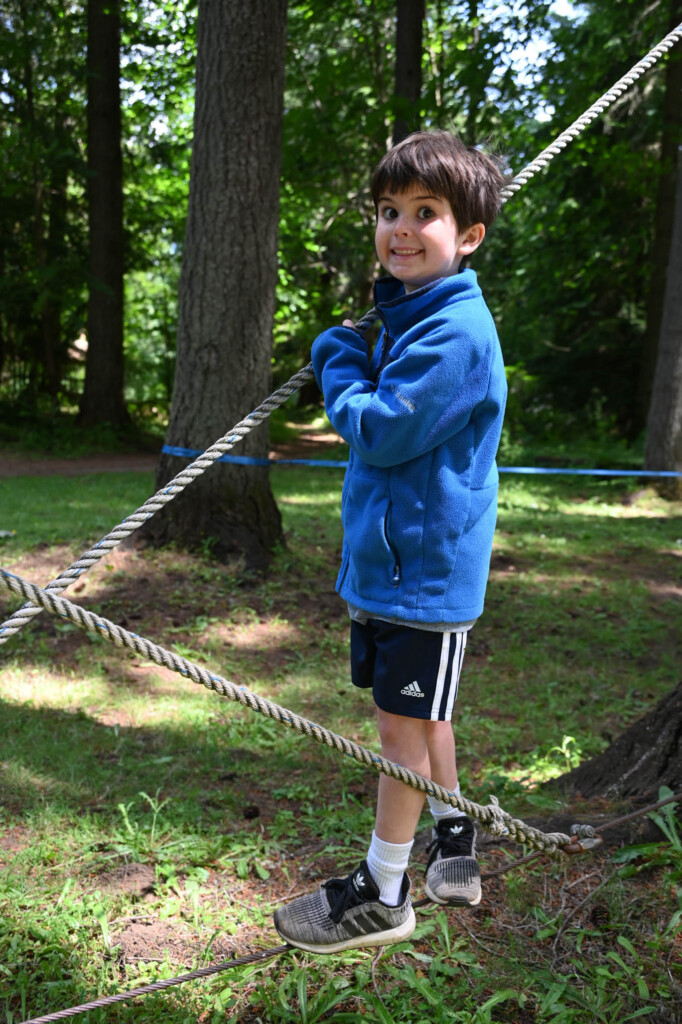 boy walking on rope.