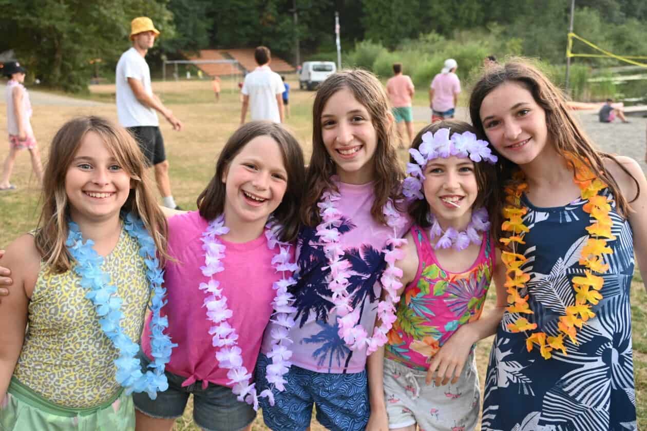 A group of campers wearing leis.