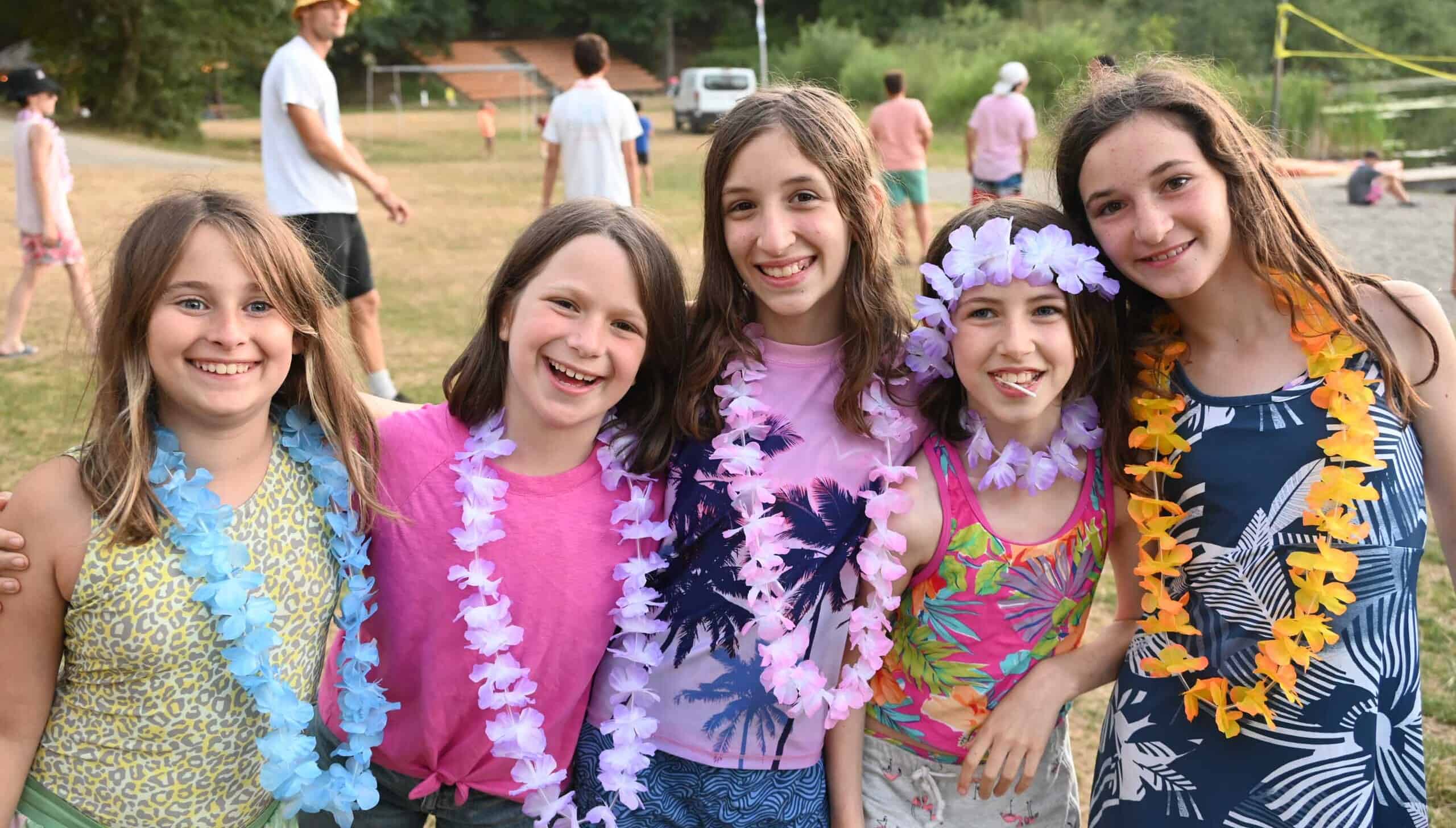 A group of campers wearing leis.